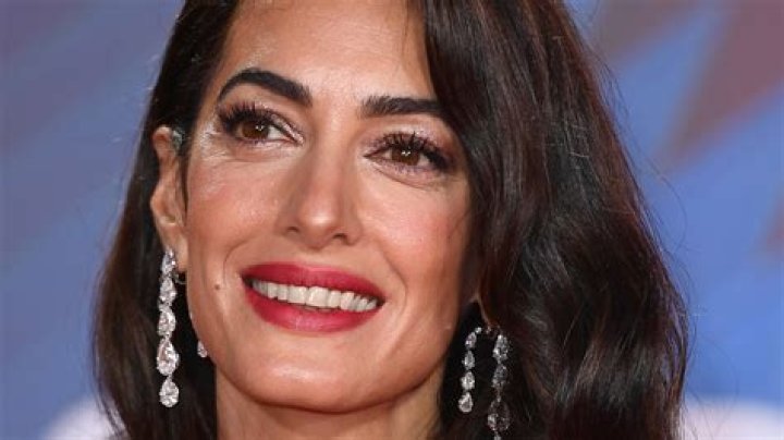 Amal Clooney's pregnancy chic wife shows off her baby bump in