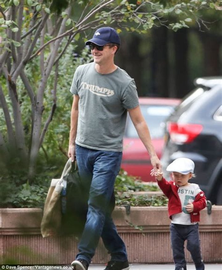 Doting dad Edward Norton showed how gentle he can be as he took his 17monthold son for in