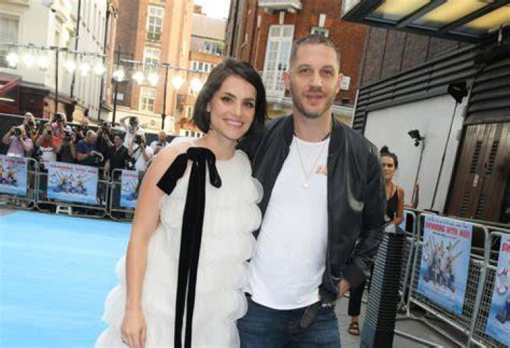 English actor Tom Hardy and his girlfriend Charlotte Riley attend the