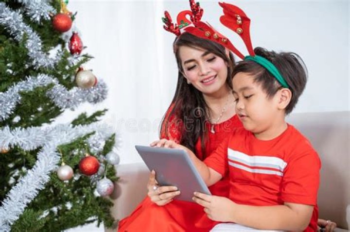 Kid with Mum Using Mobile Tablet Together Stock Image Image of sofa