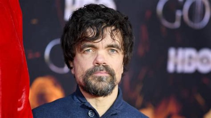 Peter Dinklage's daughter stays warm beneath a pair of enormous red ear