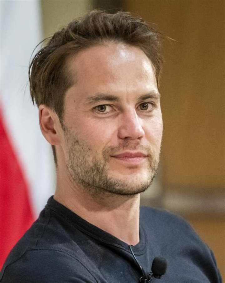 Taylor Kitsch with short hair and girlfriend with Connie Britton at