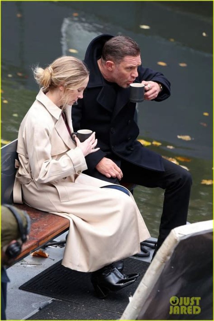 Tom Hardy braves the wet weather with wife Charlotte Riley