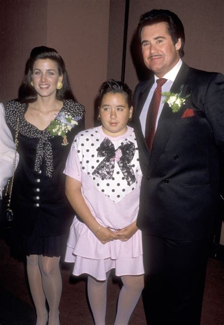 Wayne Newton and his wife Kat Newton holding their newborn son, Carson